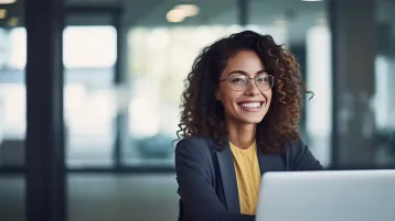 Woman using computer e1697447888793